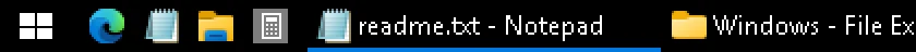 RetroBar with the community theme Flat Dark: left end of the taskbar, real screenshot at 2x