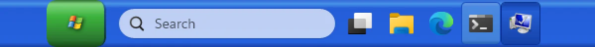 Windhawk: Taskbar Styler with its WinXP theme (middle of the taskbar, 2×). Windows 11's layout stays: centred icons and the Search box.